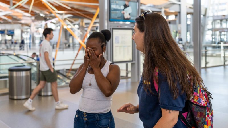 CWS-Case-Manager-Lydia-waits-with-Vanessa-at-RDU-airport-3-scaled