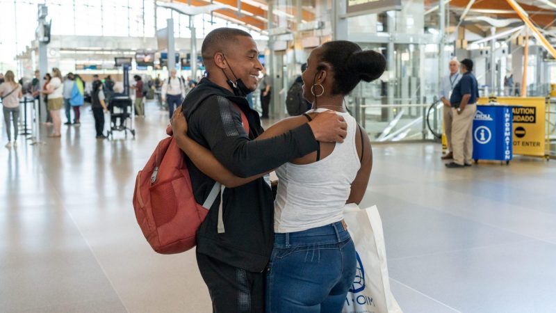 CWS-client-Vanessa-greets-her-brother-CWS-client-Luis-at-RDU-2-scaled