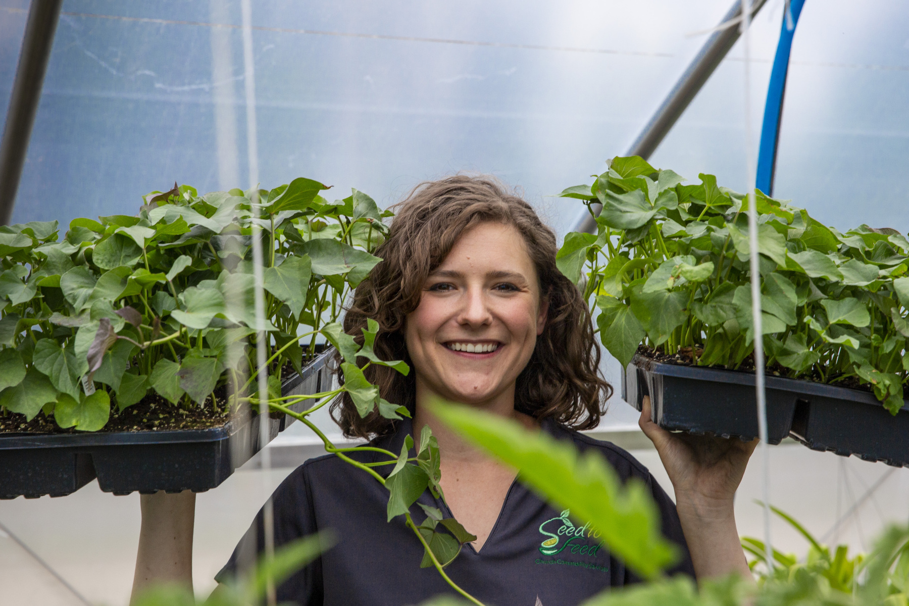 Gabby holding the trays of plants Gabby holding the trays of plants